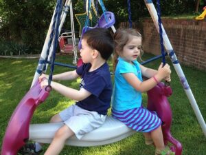 daycare kids on a swing
